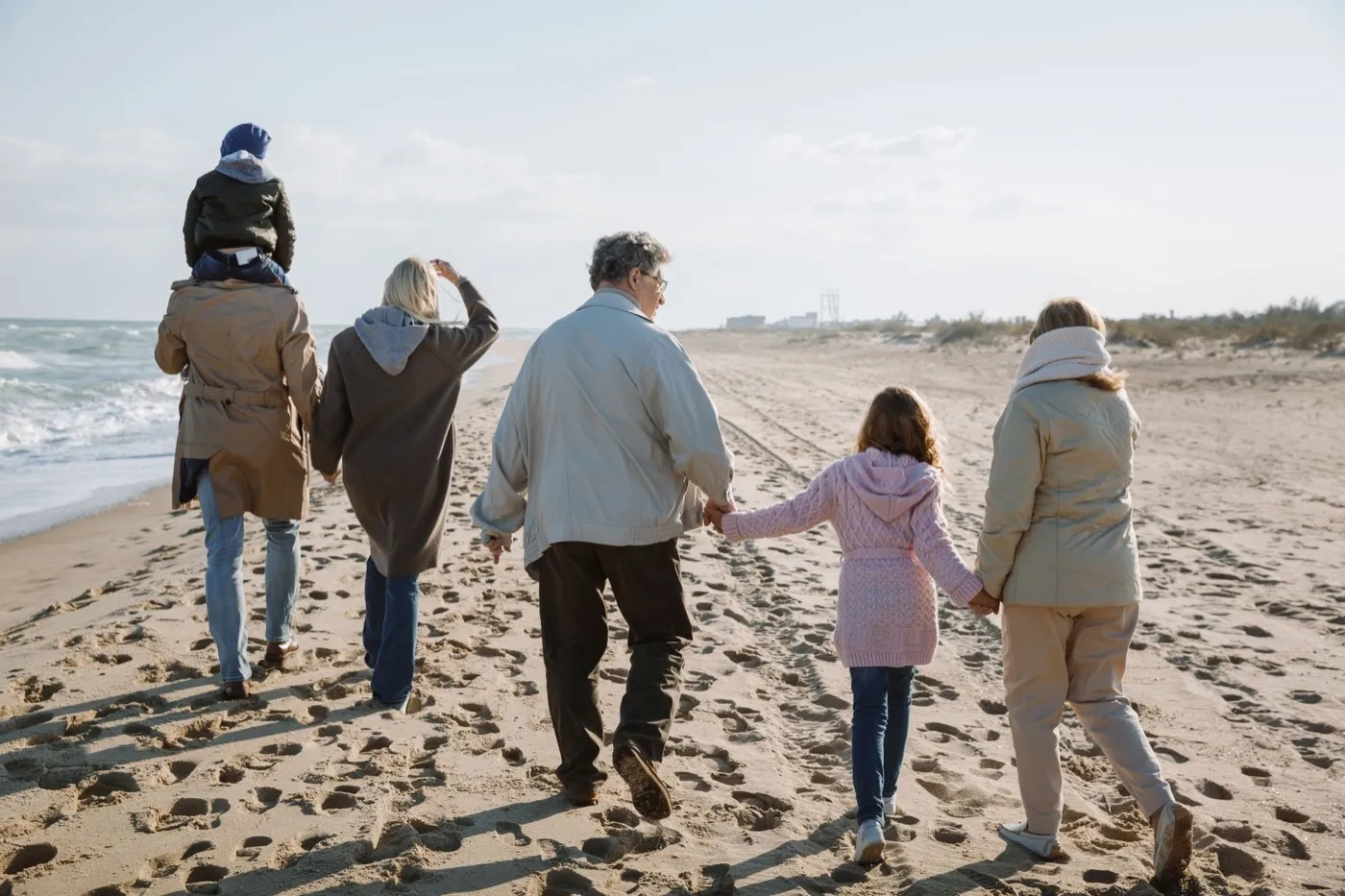 family walking on beach